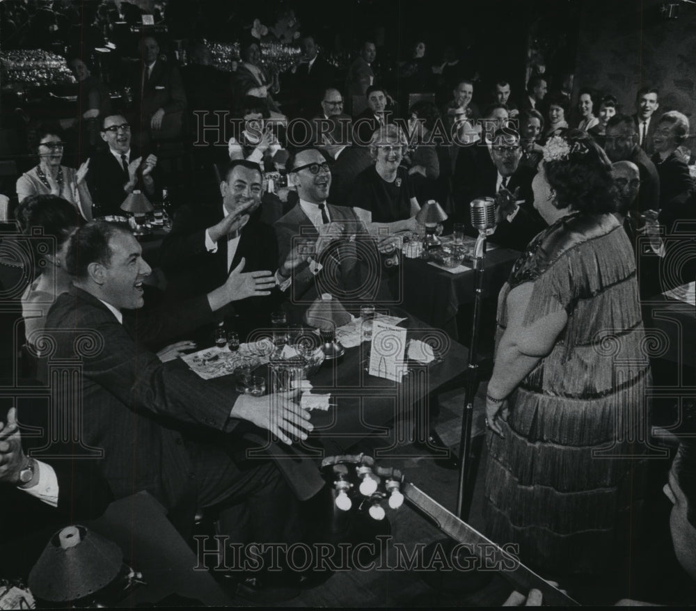 1964 Press Photo A nightclub crowd watching woman sing, Milwaukee. - mjb54781 - Historic Images