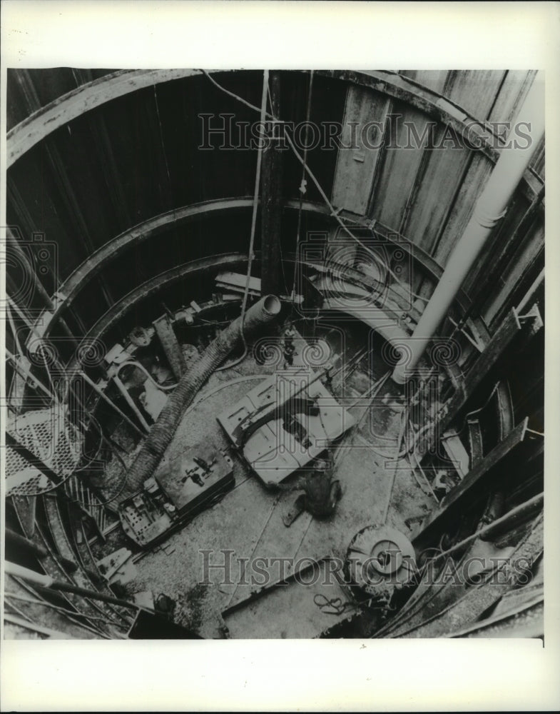 1982 Milwaukee Sewer District workers preparing materials in sewer. - Historic Images