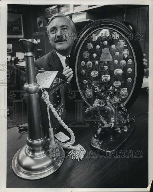 1972 Press Photo Harold Holtzman Poses With Fire Service Memorabilia - mjb57248 - Historic Images