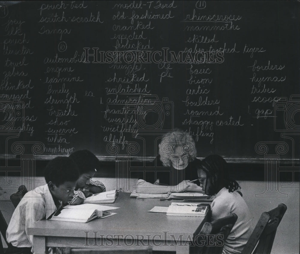 1979 Margo Grier with students during reading class, Harambee School - Historic Images