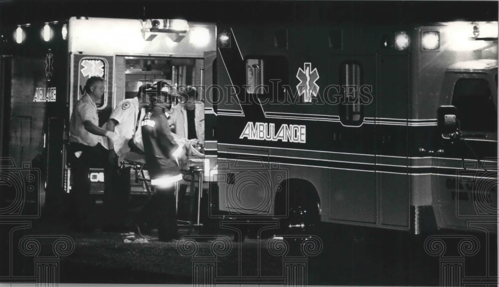1991 Medical personnel remove body of a man in Oak Creek, Wisconsin-Historic Images