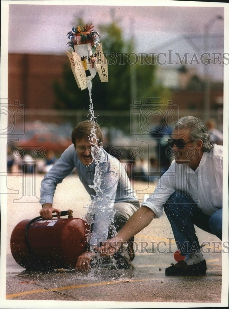 1993 Two Milwaukee school teachers launch a student&#39;s water rocket.-Historic Images