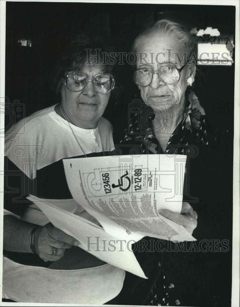 1991 Joan Hayes and Kate Townsend Holding Disabled Parking Papers - Historic Images