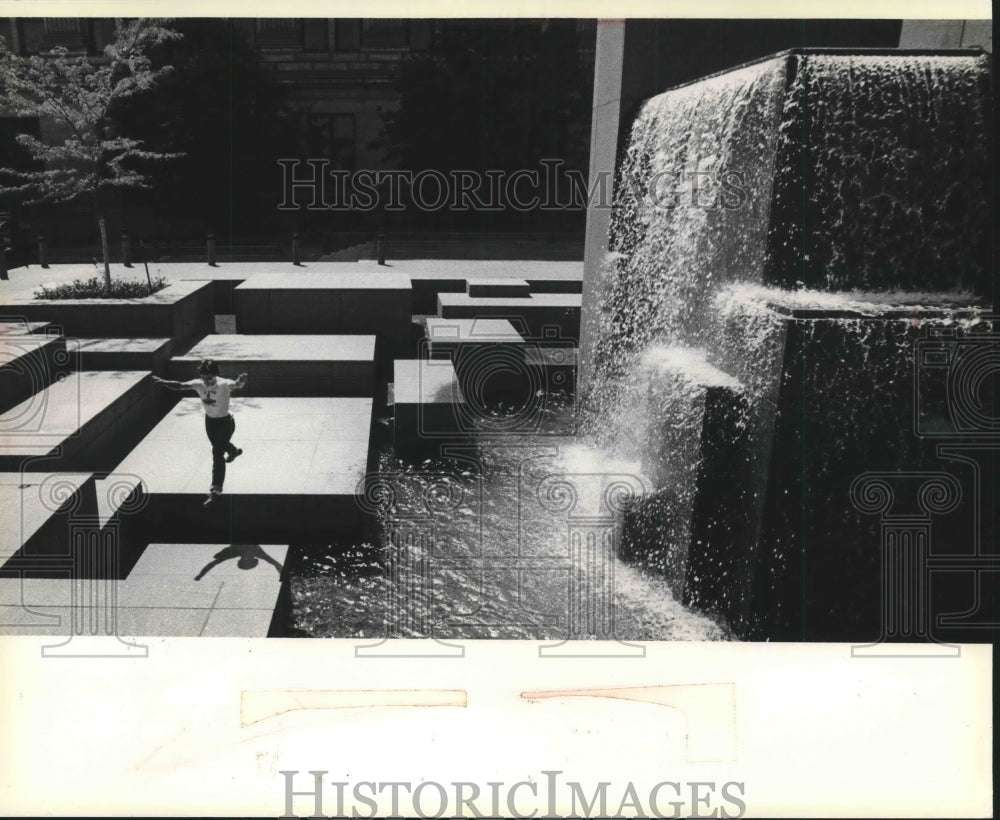 1980 Boy playing in Fountain at Northwestern Mutual Life Place - Historic Images
