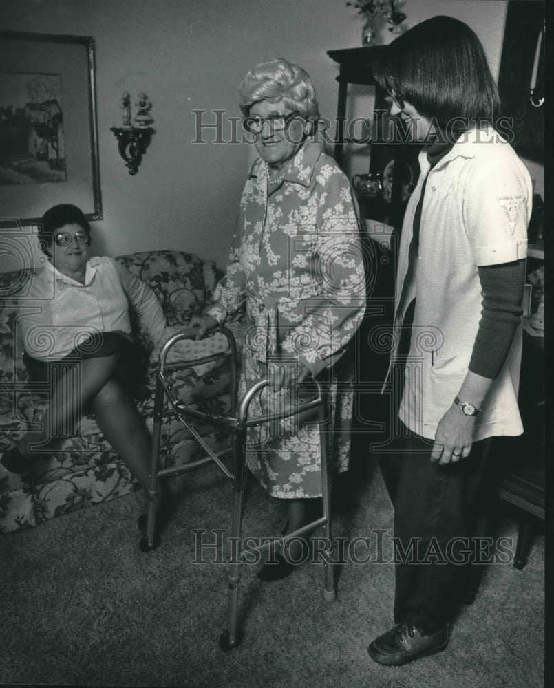 1985 Ellen Driscoll, physical therapist, helps Clara Raaf. Wauwatosa - Historic Images