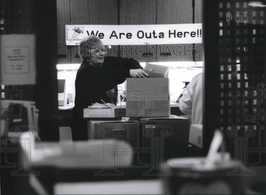 1995 Karen Rebarchik, library clerk packing boxes, Wisconsin. - Historic Images
