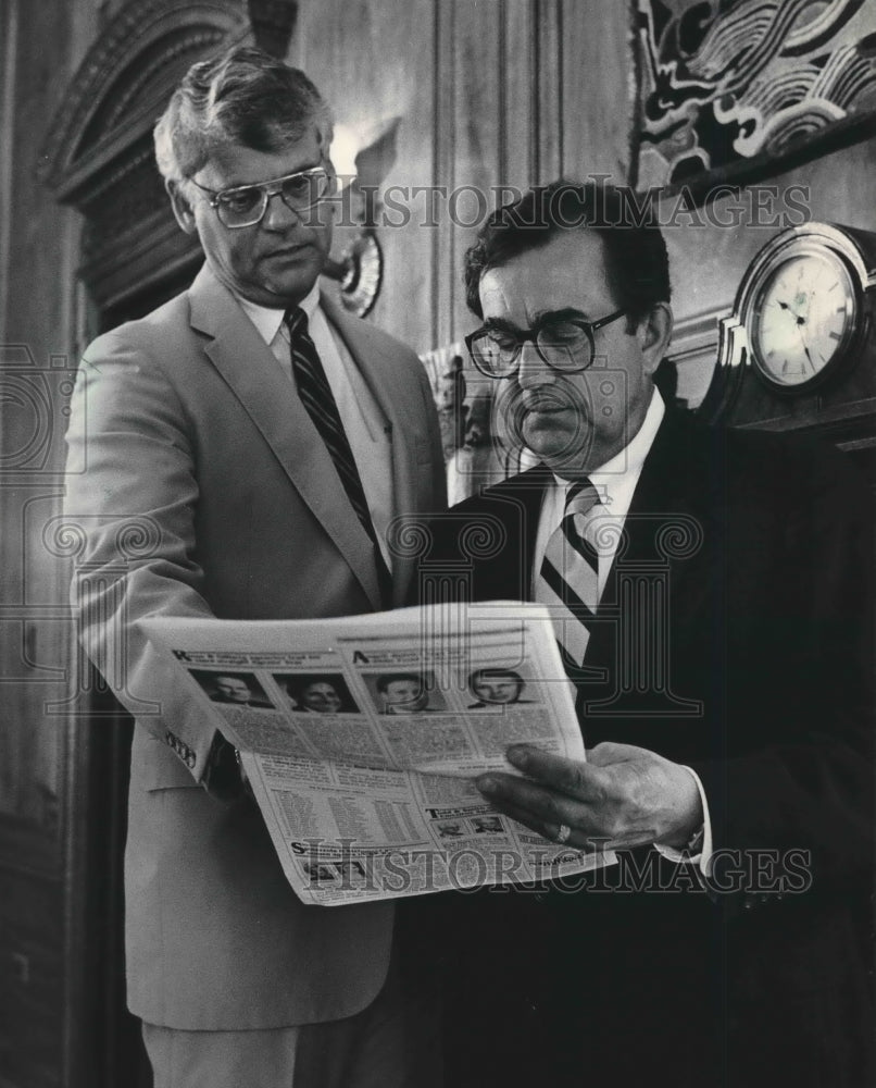 1984 Northwestern Mutual Life leaders check out newspaper.-Historic Images
