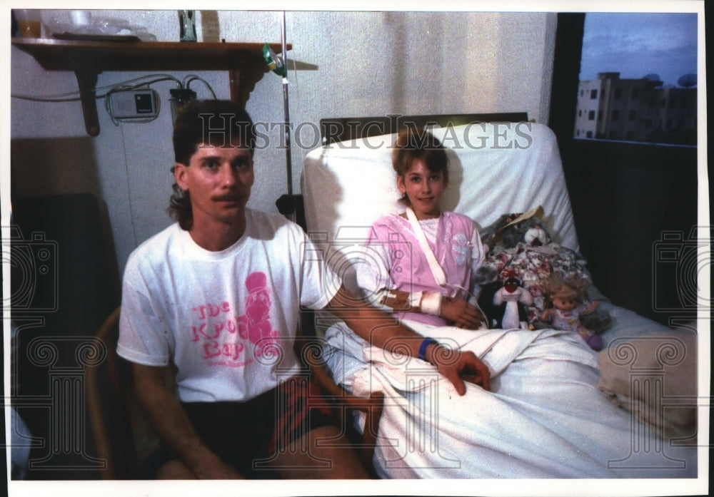 1993 Trisha Holz in a hospital bed with her father Daryl Holz - Historic Images