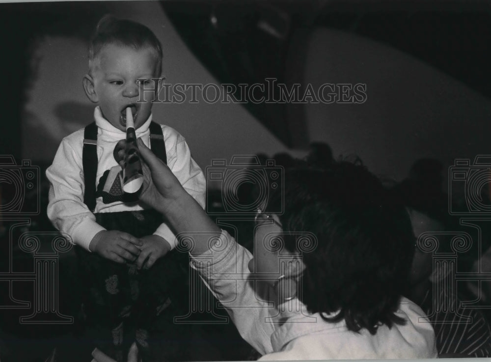 1993 Johnathan received instruction on party horns. Milwaukee - Historic Images