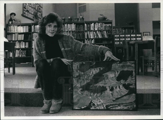 1989 Julie Briede O'Connor holds painting at Hales Corners Library - Historic Images