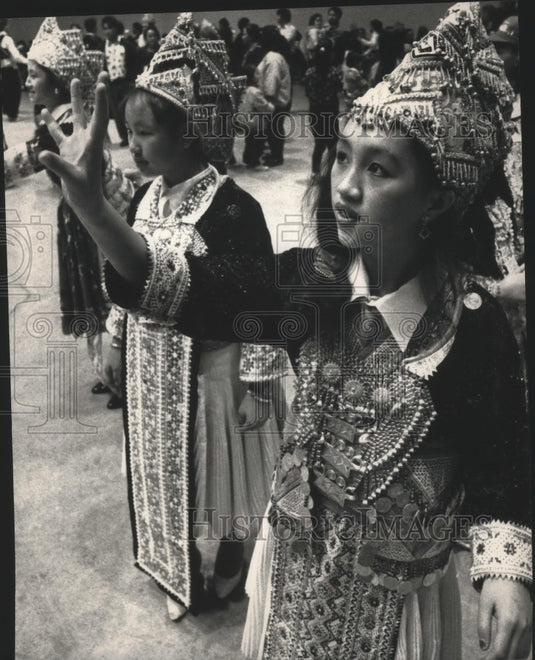 1991 Hmong girls perform "pov pob" in entertainment at Waukesha Expo - Historic Images