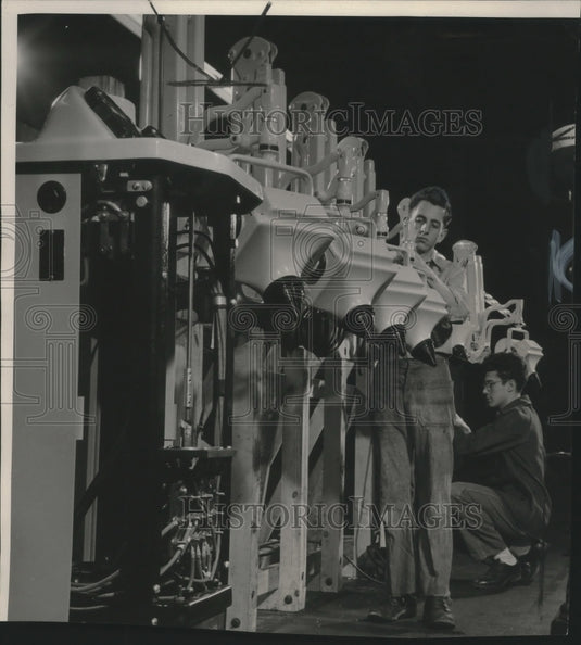 Press Photo Two men inspecting machines - mjb65172 - Historic Images
