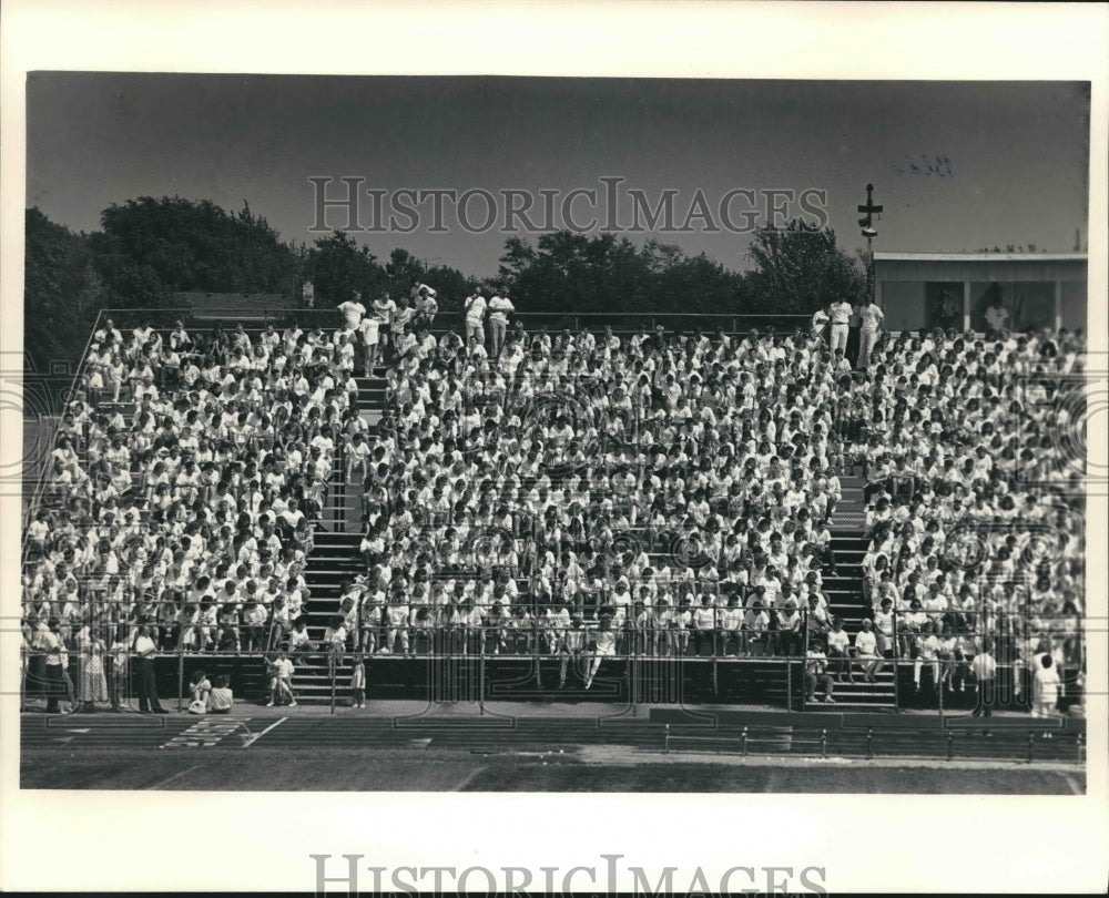 1987 Students in bleachers, Oconomowoc, WI, High School - Historic Images