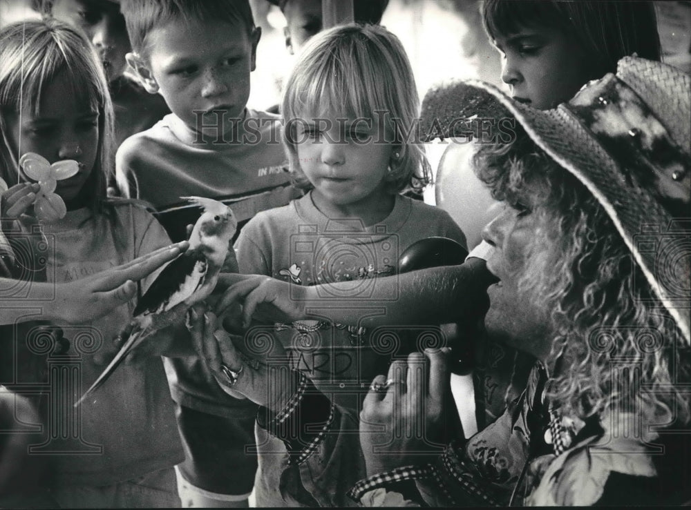 1991 Youngsters fun with birds during Mawell Street Days Oconomowoc - Historic Images