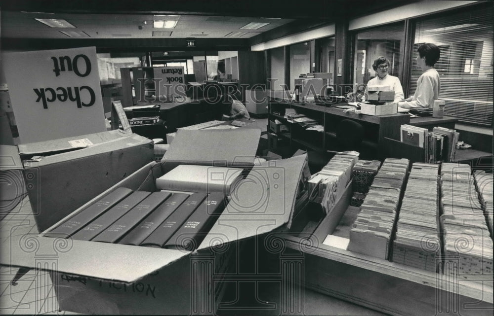 1987 Librarians get new building organized. Oconomowoc, Wisconsin-Historic Images