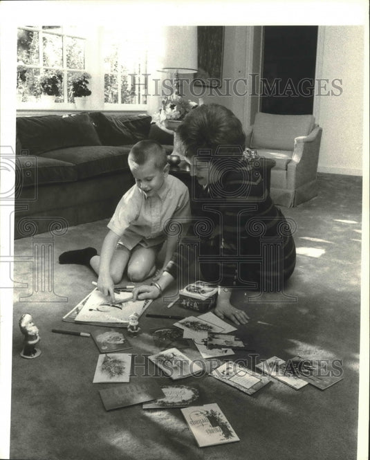 1969 Press Photo Mrs. Walter Hickel and son decorate Christmas cards - mjb66920 - Historic Images
