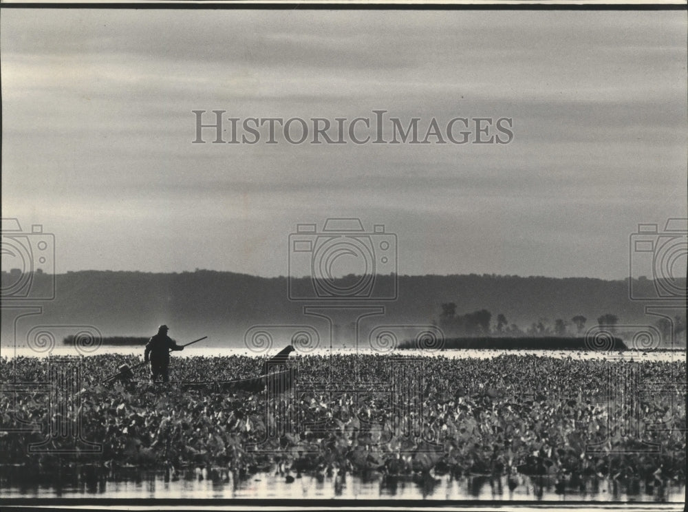 1985 Wisconsin duck hunter on the Mississippi River by Iowa Bluffs - Historic Images
