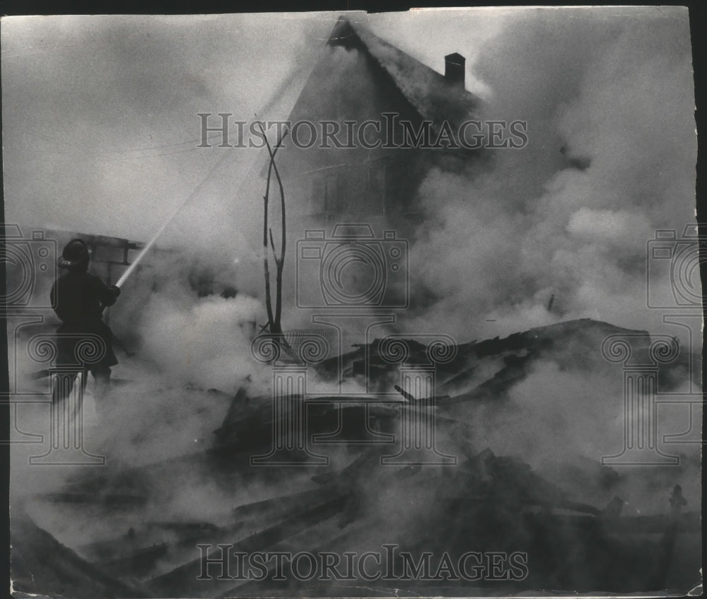 1971 Milwaukee fireman fighting fire in 2300 Block W. Lloyd St.-Historic Images