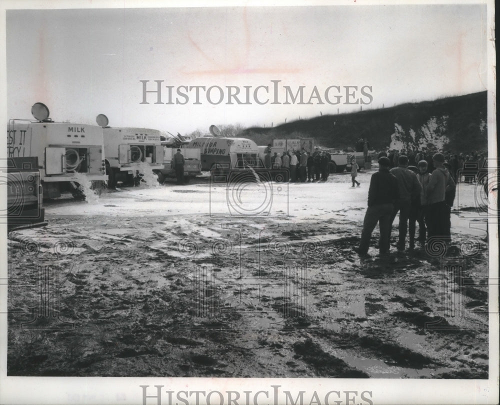 1967 Press Photo Gallons of milk dumped at gravel pit west of Cedar Grove- Historic Images