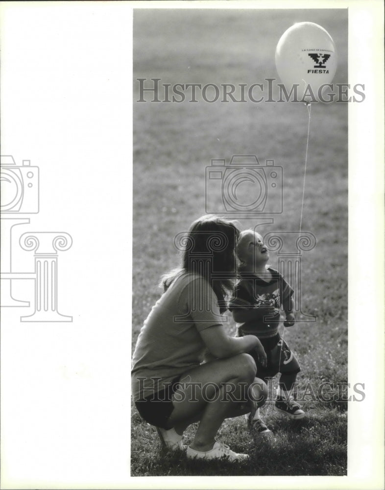 1994 Sam Szpek plays with a balloon during National Night Out - Historic Images