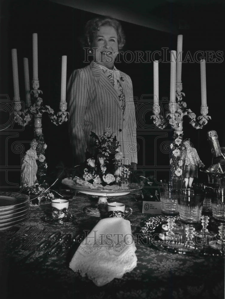 1991 AnnDre Hohenfeldt shown with her wedding service pieces - Historic Images