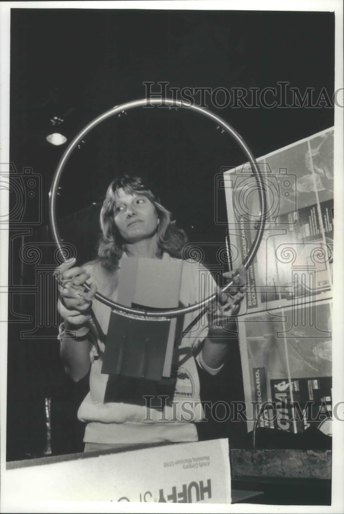 1991 Sandy Dombrowski, Huffy plant employee inspects basketball hoop-Historic Images