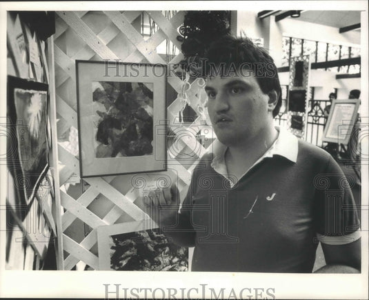 1988 John Murphy posed with his painting at Community Arts Center - Historic Images
