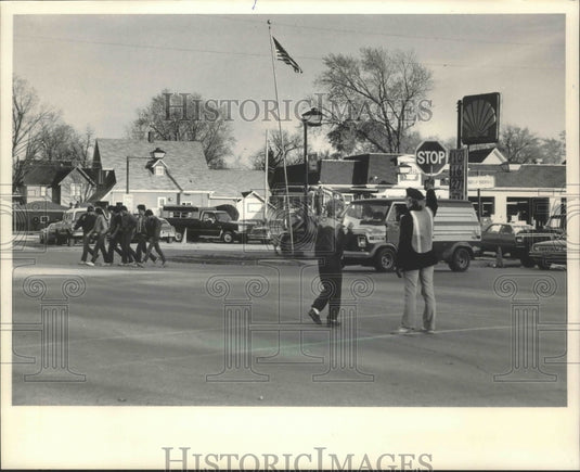 1984 Crossing guard Chris Kemnitz, intersection of Highways 99 & 83. - Historic Images