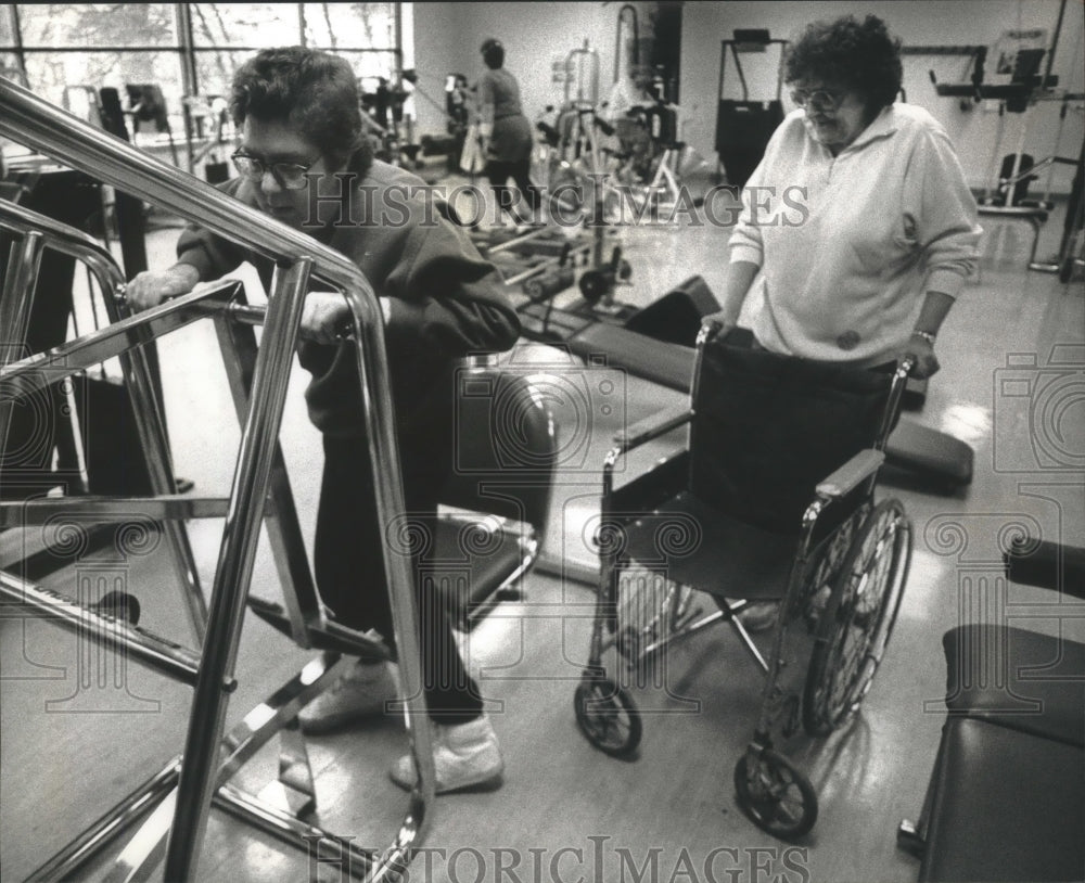 1993 Joan Hinz helps Bob Breaster on leg machine at Waukesha YWCA.-Historic Images