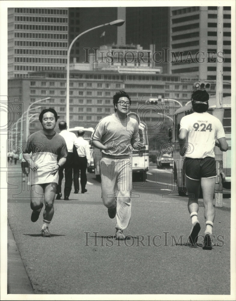 1983 Japanese men out for a jog-Historic Images