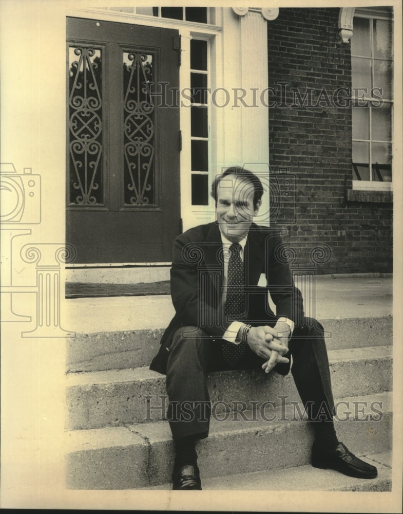1983 Roger Hull, Beloit College President sits on steps - Historic Images