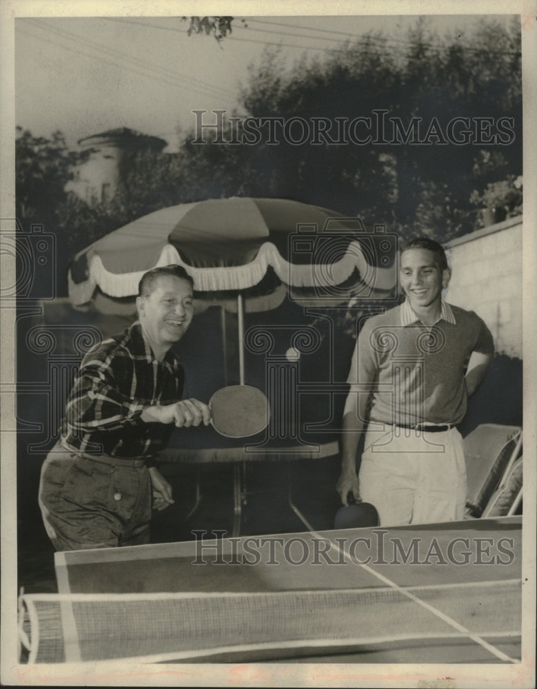 1958 Press Photo Lawrence Welk (L) shows son Larry a nifty shot. - mjb78083-Historic Images
