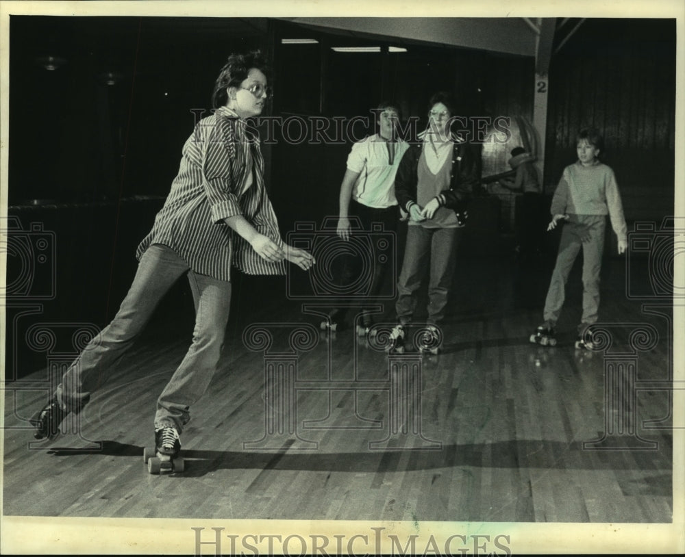 1985 Roller skaters at Waukesah Skateland or cancer education - Historic Images
