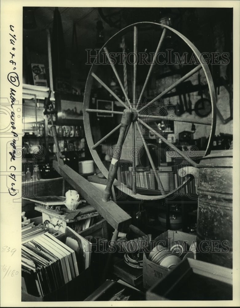 1984 Rummage Sales, books, dishes and spinning wheel-Historic Images