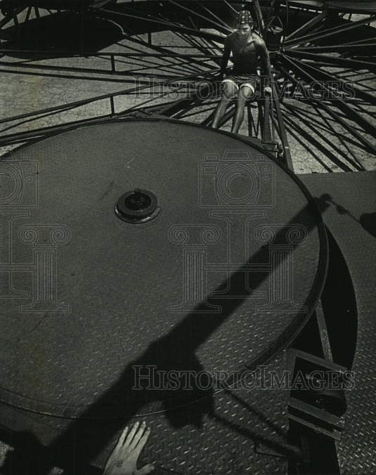 1992 South Shore Park, Carnival worker assembles Tilt-A-Whirl - Historic Images