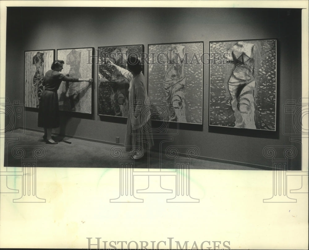 1985 Ladies hanging art work, Nine Views of Winter in Posner Gallery - Historic Images