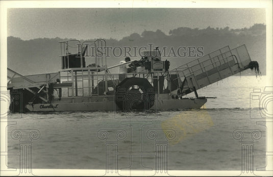 1989 A weed harvester from Sanitary District on, Pewaukee Lake. - Historic Images