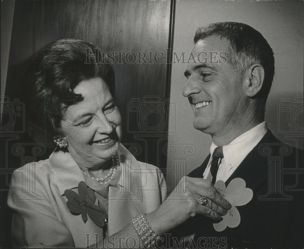 1968 Press Photo Mrs. Bohmann pins shamrock tag on Mark Pfaller architect. - Historic Images