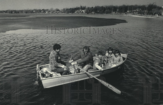 1986 Jim Densmore, Dino Moreno and children, row boat Pewuakee Lake-Historic Images