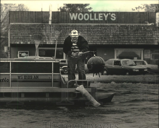 1987 Bill Woolley worked from his "Minesweeper" on Pewaukee Lake-Historic Images