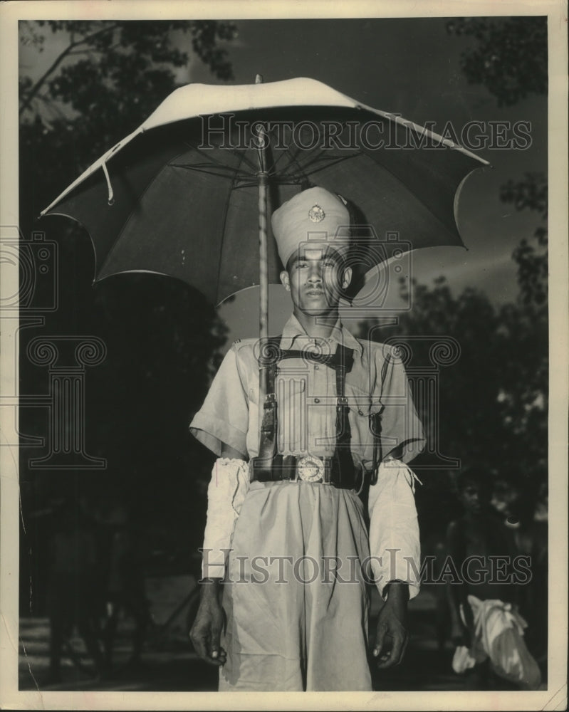 1948 Press Photo India, Assam Traffic Cop with his umbrella. - mjb81875 - Historic Images