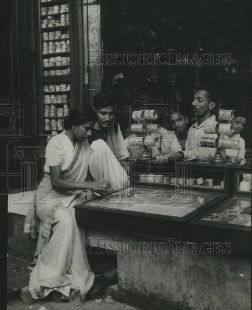 1949 India, Susharan helps wife select some trinkets for souvenirs-Historic Images