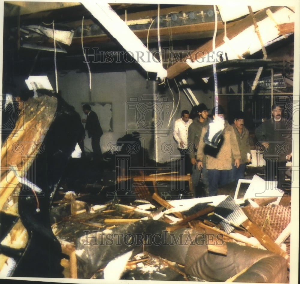 1993 Iraq rescue workers survey damage to Baghdad&#39;s Al Rashid Hotel - Historic Images