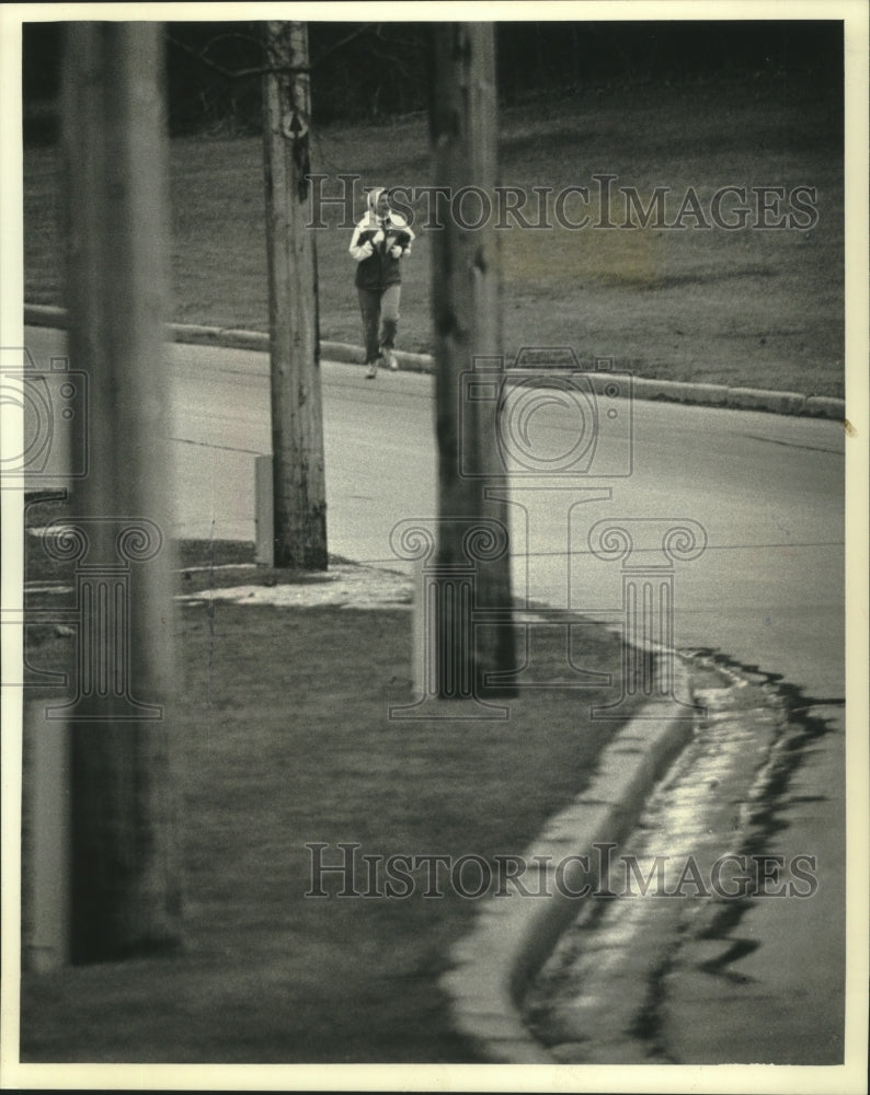 1991 A jogger runs along Menomonee River-Historic Images