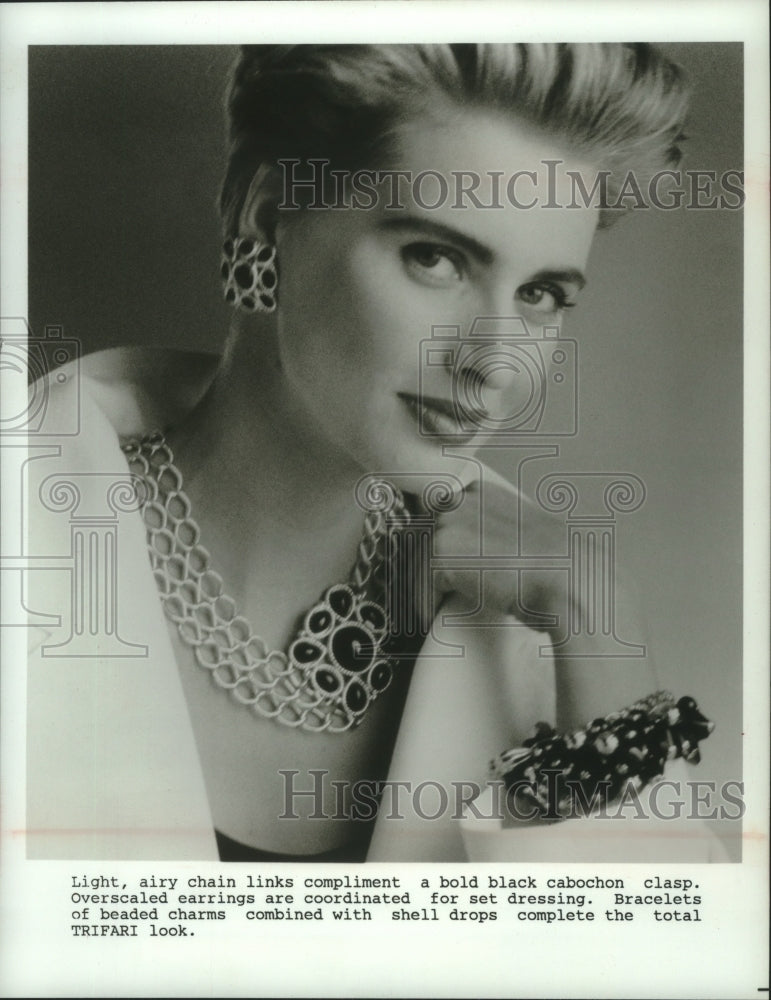 1991 Model wears jewelry designed as Trifari accessory - Historic Images