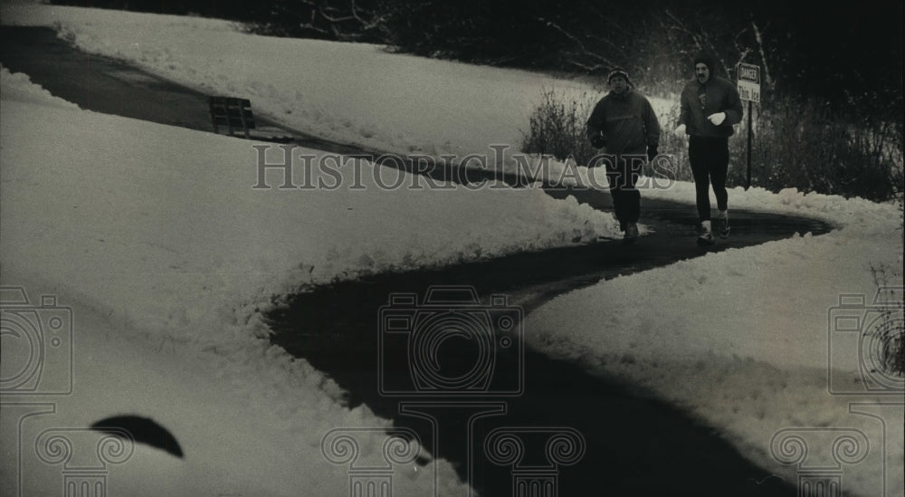 1993 Snow piles along the path doesn&#39;t stop two joggers-Historic Images