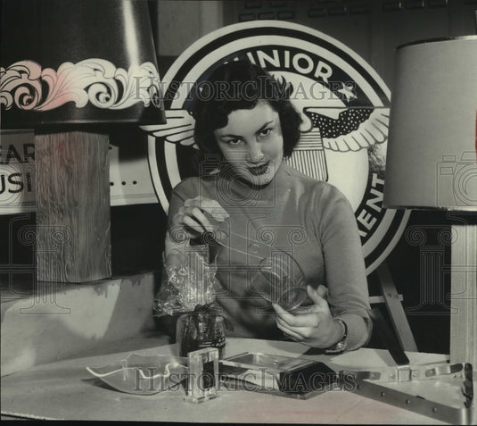 1957 Press Photo Pamela Lynch showing small products made by Junior Achievement.-Historic Images