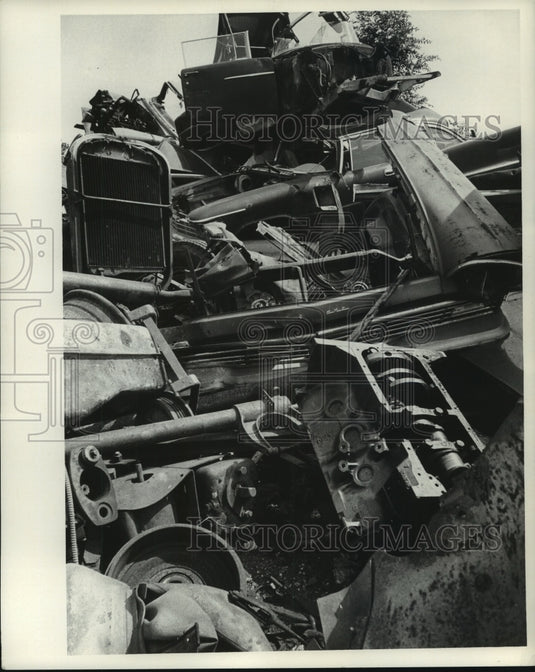 1968 Piles of junked auto in suburban area-Historic Images