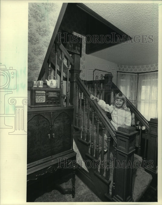 1983 Rhiannon Manke sits on her home's staircase, Pewuakee Wisconsin-Historic Images