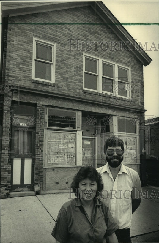 1987 Barbara & Randy Kafka outside house they are remodeling - Historic Images